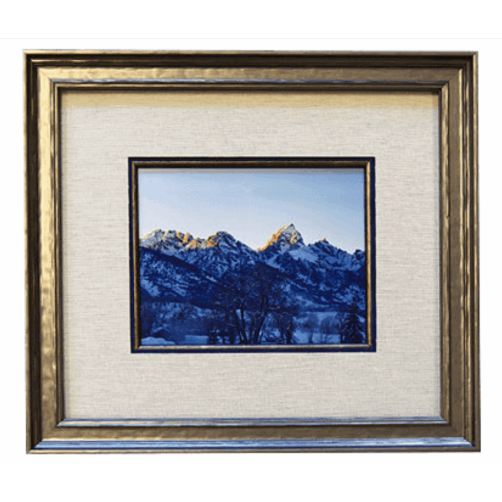 A framed photo of mountains